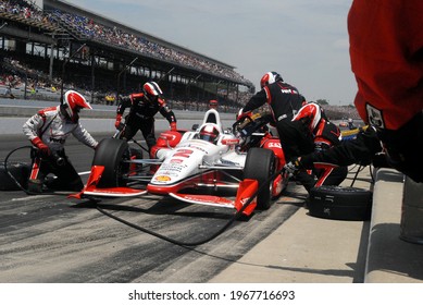 Speedway, IN, USA - May 24, 2015:  IndyCar and former Formula 1 driver Juan Pablo Montoya makes a pit stop on his way to winning the 2015 Indy 500 at Indianapolis Motor Speedway.