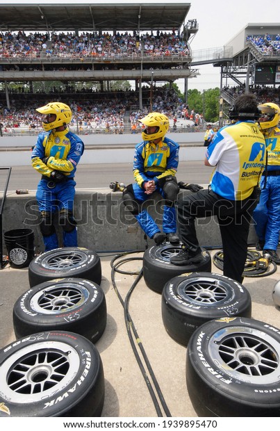 Speedway, IN, USA - May 29, 2011:  A pit crew\
waits for their driver to make a pit stop during the 2011 Indy 500\
at Indianapolis Motor\
Speedway.	