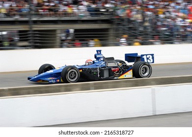 Speedway, IN, USA - May 30, 2004: Greg Ray's Battered Race Car, Slightly Blurred To Show Speed, Rockets Down The Main Straight During The 2004 Indy 500 At Indianapolis Motor Speedway.