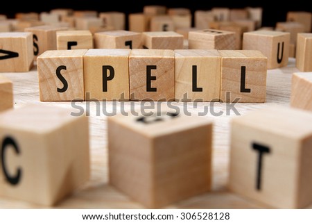 SPELL word written on wood block