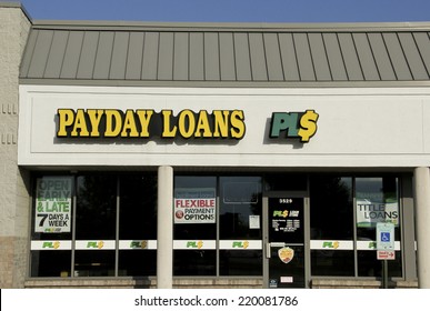 SPENCER , WISCONSIN Sept.28 , 2014: Payday Loans Sign on a Store Front. Payday Loans is a short term loan company.