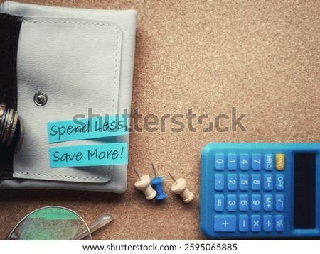 Spend less save more text on note paper with copy space background. Stock photo.