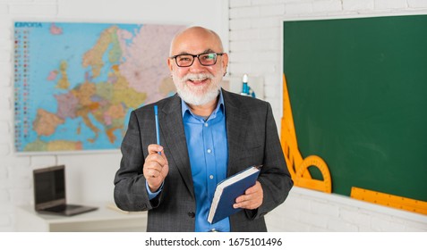 spend time trying. classroom with map and blackboard. back to school. education in retro school. bearded man give marks in diary. write notes in book. senior teacher make notes. teacher of geography. - Powered by Shutterstock