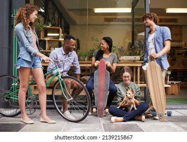 Spending With Friends Is Always Fun. A Shot Of A Five Young Friends Outside A Cafe.