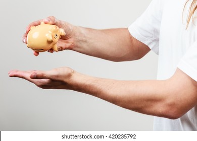 Spending Money Concept. Male Hands With Coins Of Polish Zloty Pln. Savings.