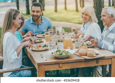 Spending Time With Family. Happy Family Of Five People Communicating And Enjoying Meal Together While Sitting At The Dining Table Outdoors