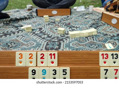 spending time playing okey at the picnic, close-up of the okey game and stones,