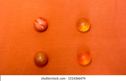 spheres for your design Colored balls on orange surface background - Powered by Shutterstock