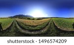 Spherical panorama of green fields in the mountains