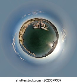 Spherical panorama of the port, little planet white boats and yachts moored in marina. Riviera during sunset, yachts in marina sea. 360 degree sailing yacht