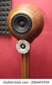 Spherical Wooden Sound Speaker With A Tweeter On A Wooden Stand.