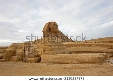Sphinx, ancient Egyptian limestone statue of a mythical creature with a lion's body and a human's head. It is located on the Giza Plateau, famous Pyramid Complex near Cairo, Egypt, North Africa