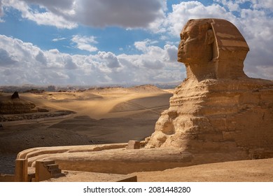Sphinx close-up and pyramids at Giza, Cairo