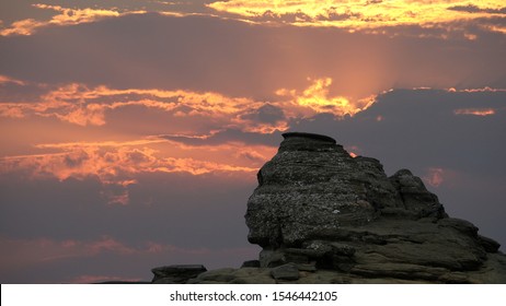 The Sphinx Rock (Sfinxul) in Bucegi Mountains Romania at sunset