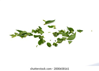 Spice Chopped Basil. Fresh Chopped Green Basil Leaves Isolated On White Background. Spicy Aromatic Sliced Raw Basilic Or Ocimum Herbs. Basil Sprinkle.