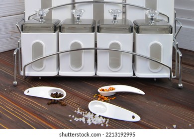 Spice Container Set On The Wooden Table.