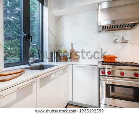 Spice Kitchen with white cabinets range and window