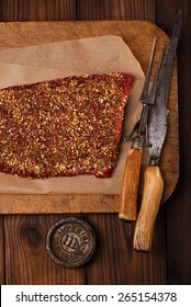 Spice Rubbed Raw  Beef, Making Jerky Meat On Wooden Backdrop With Vintage Curving Fork