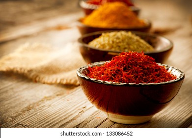 Spice. Various Spices over Wooden Background. Saffron, turmeric, curry