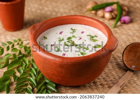 Spiced buttermilk chaas  chaach  moru  sambharam  curd lassi  yogurt cool refreshing drink for hot summer in glass , Kerala, India. Flavored Indian buttermilk.