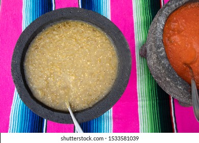 Spiced red tomato salsa and spiced green salsa for seasoning traditional Mexican food at a street food market, selective focus. Green jalapeno spicy dipping sauce and red peppers tomato spicy chili - Powered by Shutterstock