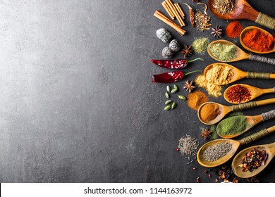 Spices For Cooking With Kitchen Accessories On An Old Background