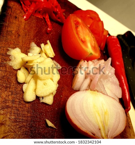 Spices cooking preparation in the kitchen.Indonesian food.soft focus to chili,onion,garlic&tomato.noise photo.blurry background