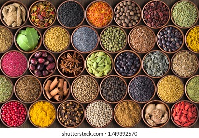 Spices And Herbs In Cups. Colorful Seasonings Wallpaper