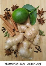 Spices and herbs ginger cinnamonsticks star anise cloves cardamom and lime
