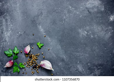 Spices, Herbs And Greens Ingredients For Cooking Food Background On Black Slate Table Top View