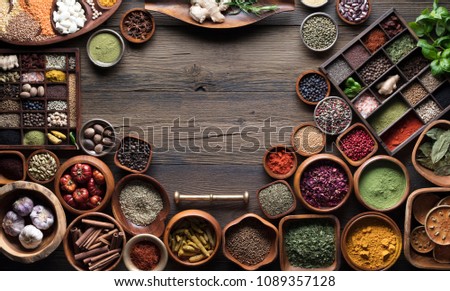 Spices and herbs. Rustic kitchen table. Place for typography.