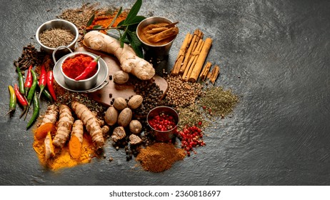 Spices on dark background. Different varius. Top view, copy space.