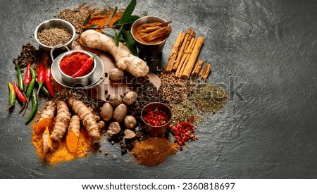 Spices on dark background. Different varius. Top view, copy space.