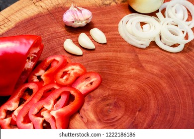 Spices On Wooden Board, Garlic, Onion And Red Bell Pepper, Space For Texte Or Product Allocation