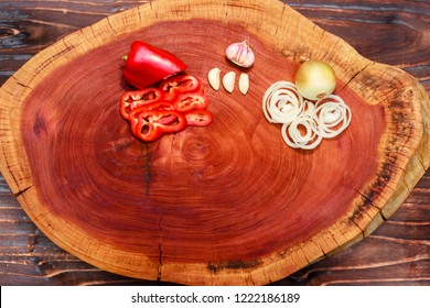 Spices On Wooden Board, Garlic, Onion And Red Bell Pepper, Space For Texte Or Product Allocation