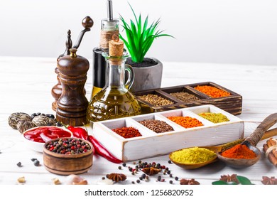 Spices and seasonings on the kitchen table on the old background - Shutterstock ID 1256820952