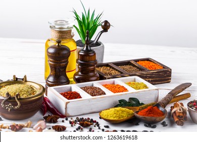Spices and seasonings on the kitchen table on the old background - Shutterstock ID 1263619618