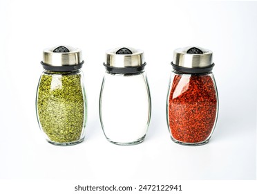 Spices set in jar on white background, isolated, salt, redpepper, dried mint
