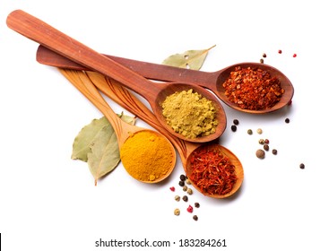 Spices. Spice in Wooden spoon. Herbs. Curry, Saffron, turmeric, cinnamon and other isolated on a white background - Shutterstock ID 183284261
