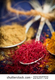 Spices From Zanzibar: Saffron, Turmeric And Cumin On Silver Spoons.