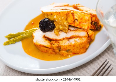 Spicy Baked Turkey Breast Served In Mango Sauce With Pickled Asparagus, Prune And Walnuts