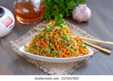 Spicy Carrot And Summer Squash Salad With Oil And Vinegar Dressing On A Plate. Grated Marinated Raw Carrot And Zucchini Salad With Sesame Seeds, Garlic And Fresh Herbs In Korean-style. 