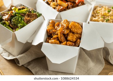 Spicy Chinese Take Out Food With Chopsticks And Fortune Cookies