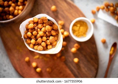 Spicy Crispy Roasted Chickpeas With Paprika, Curry And Hot Chili Pepper, Selective Focus, Top View. Tasty Vegetarian And Vegan Chickpea Snack.