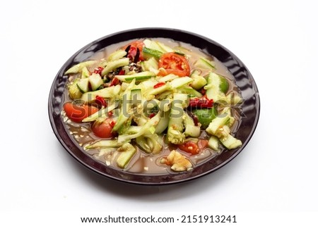 Spicy cucumber salad in plate