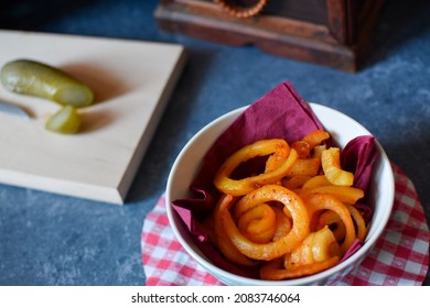 Spicy Curly Fries In A Bowl On A Table