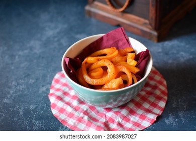 Spicy Curly Fries In A Bowl On A Table