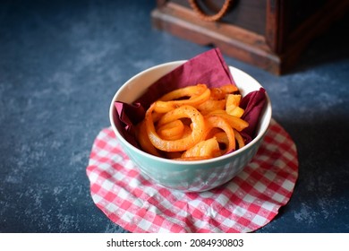 Spicy Curly Fries In A Bowl On A Table