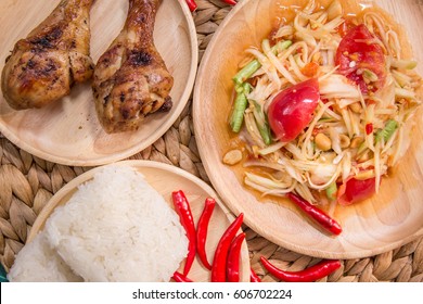 Spicy and famous traditional Thailand food set, included SOM-TUM-THAI (PAPAYA POK POK) or papaya salad served with sticky rice and grilled chicken