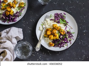 Spicy Fish Taco Bowls - Couscous, Spicy Grilled Fish And Red Cabbage. Delicious Food. On A Dark Stone Background.  Top View